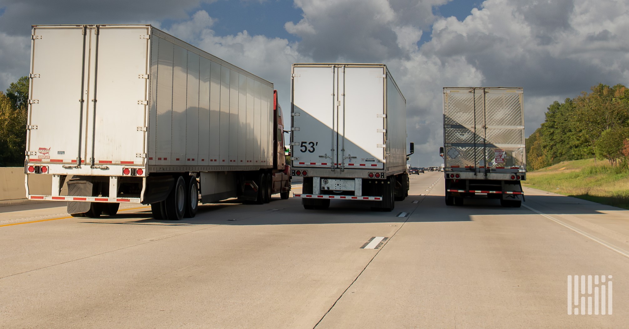 Multiple trucks on highway